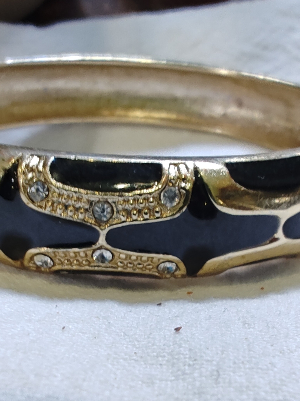 Gold-tone Bangle Bracelet with Black Enamel and Crystal Accents